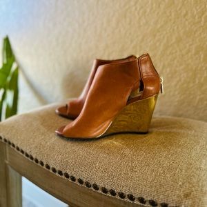 Jessica Simpson Brown leather wedges with gold heel.